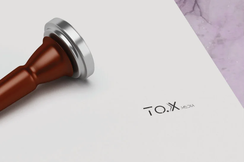 TO.X Media identity printed on stationery